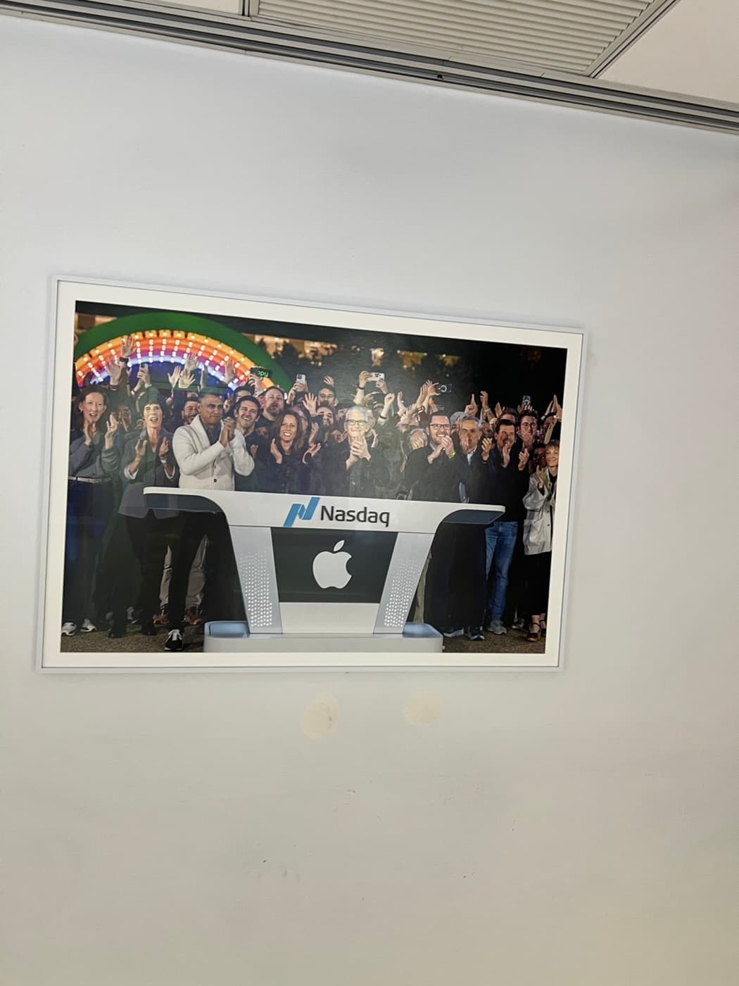 Framed photo of the Apple bell ringing at Nasdaq
