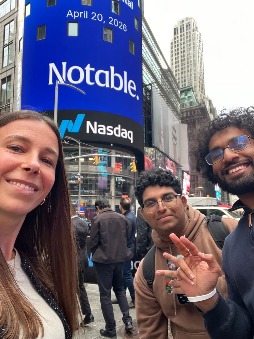 Selfie in Times Square under the Notable and Nasdaq billboard