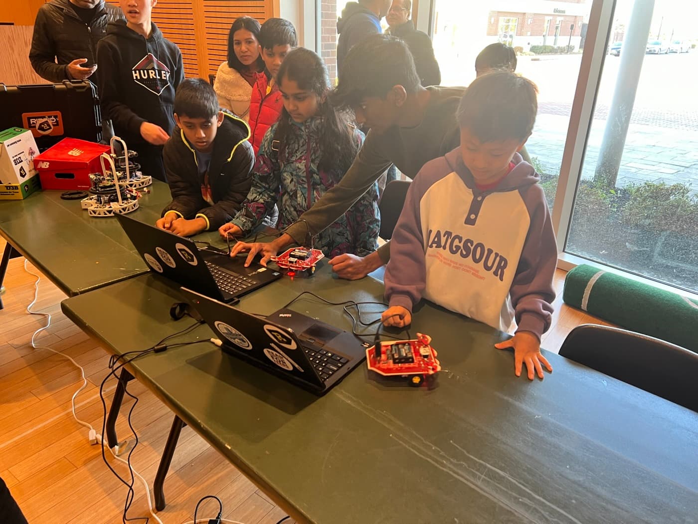 Teaching kids to program robots at a robotics workshop